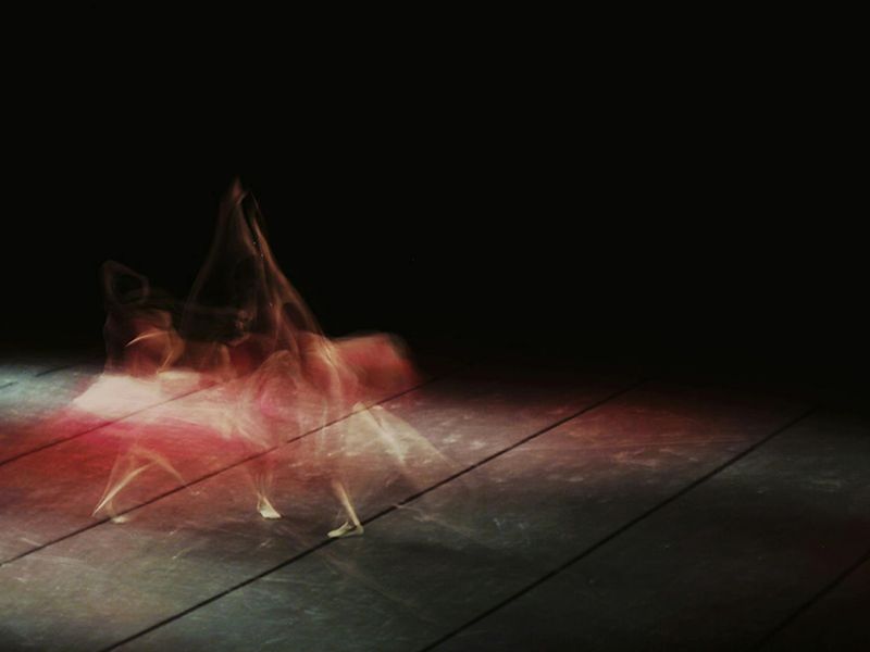 A person in motion captured with a slight blur, showing fluidity.